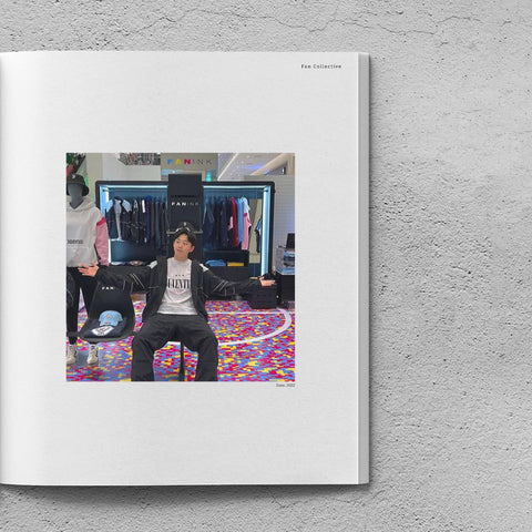 Man sits in a chair at the Fan Ink Pop-up event in Korea. He wears the Juventus Stadium Jacket over the Juventus Icon T-Shirt, and the Juventus Stadium Pants.