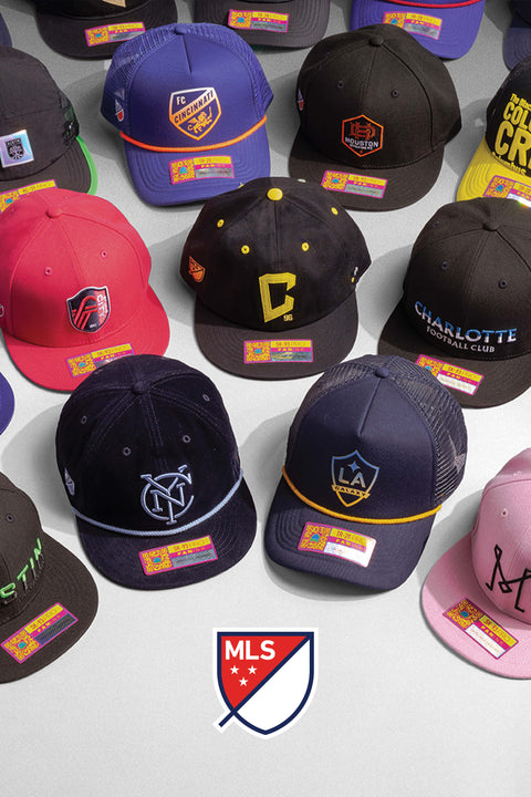 Multiple MLS club hats by Fan Ink on a white backdrop