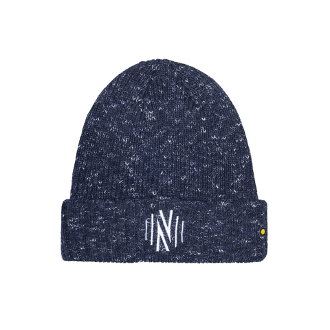 A dark navy blue heathered knit beanie with a white embroidered stylized 'N' logo on the front cuff and a small yellow tag on the side, shown against a solid black background.