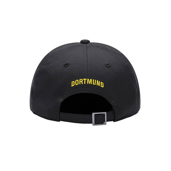 Back view of the Borussia Dortmund Trigger Adjustable hat with mid constructured crown, curved peak brim, and slider buckle closure, in Black.