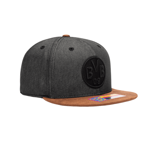 Side view of the Borussia Dortmund Orion Snapback with high structured crown, flat peak suede-like brim, and snapback closure, in Black/Brown.