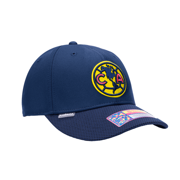 Side view of the Club America Trigger Adjustable hat with mid constructured crown, curved peak brim, and slider buckle closure, in Navy.