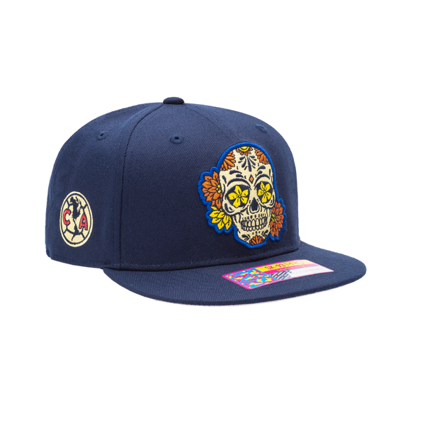 Club America Day of the Dead Snapback Hat with floral skull embroidered on the front, Club America embroidered on the side, "Dia de Muertos" embroidered on the back. The hat has a high crown, flat peak brim, and a snapback closure.