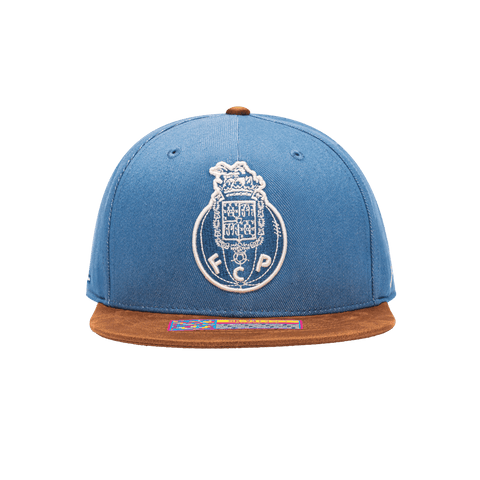 Front view of the FC Porto Orion Snapback with high structured crown, flat peak suede-like brim, and snapback closure, in Blue/Brown.