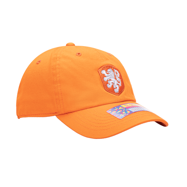 Side view of the Netherlands Bambo Classic hat with low unstructured crown, curved peak brim, and buckle closure, in orange.