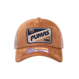 Front view of the Pumas Camionero Trucker with high crown, curved peak, and snapback closure on mesh back, in brown.