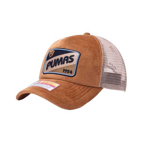 Side view of the Pumas Camionero Trucker with high crown, curved peak, and snapback closure on mesh back, in brown.