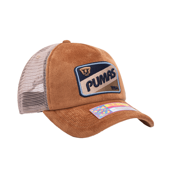 Side view of the Pumas Camionero Trucker with high crown, curved peak, and snapback closure on mesh back, in brown.